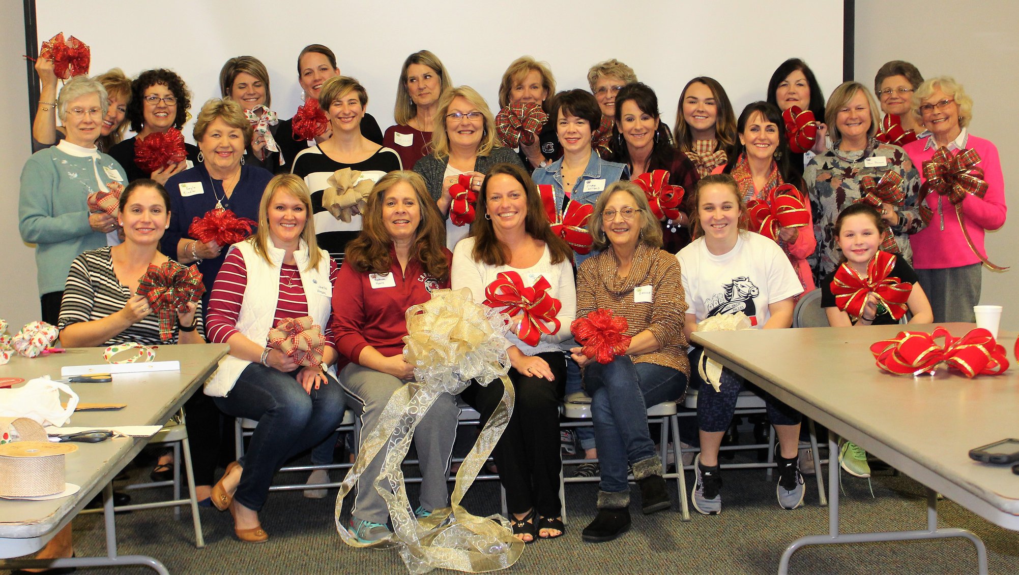 Women in the Saxe Gotha Women's Ministry showing off their ribbons