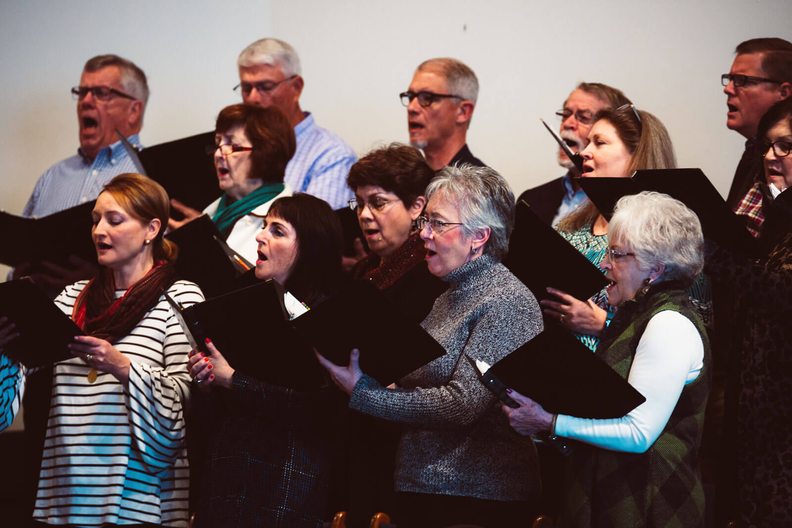 Adults singing in at a choir practice at Saxe Gotha